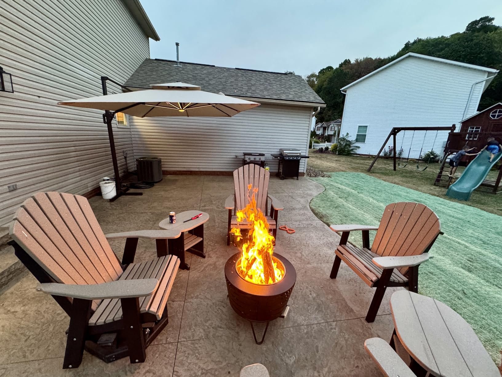 TIKI Patio Fire Pit Bundle – 25-Inch Smokeless Wood Burning Outdoor Fire Pit for Backyard, Patio, Deck & Garden with Removable Ash Pan, Stand & Weather-Resistant Cover – Modern Black Stainless Steel - Customer Photo 2